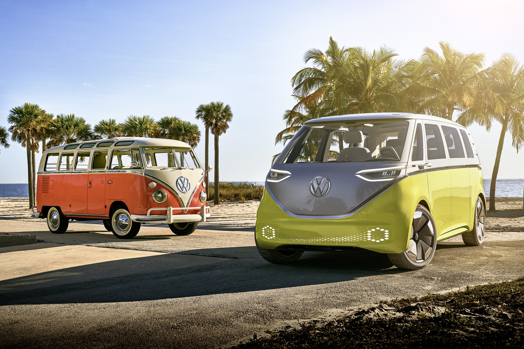 Old VW Bus and New Electric VW Buzz at the beach